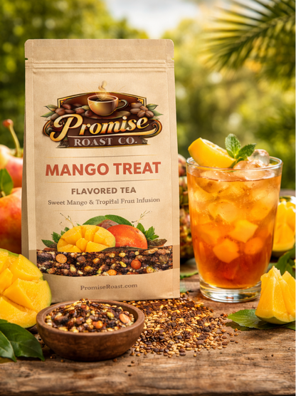 Two packages of Promise Roast Co. Mango Treat flavored tea with a glass of iced tea and mangoes on a wooden surface.